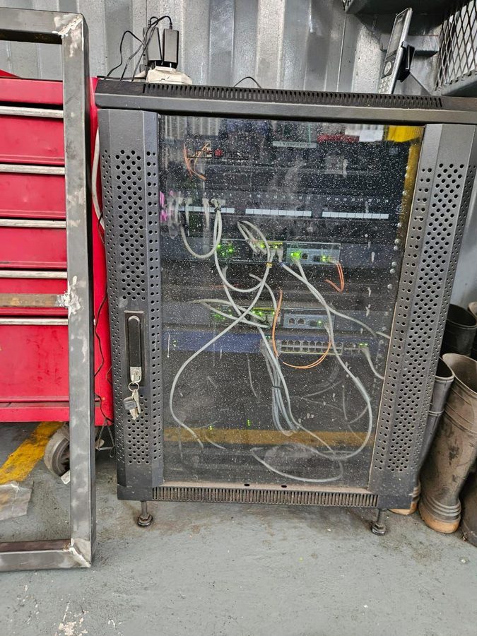 Network cabinet before cleanup
