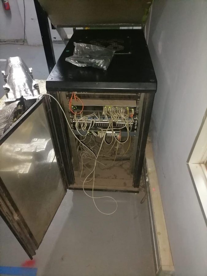 Network cabinet before cleanup