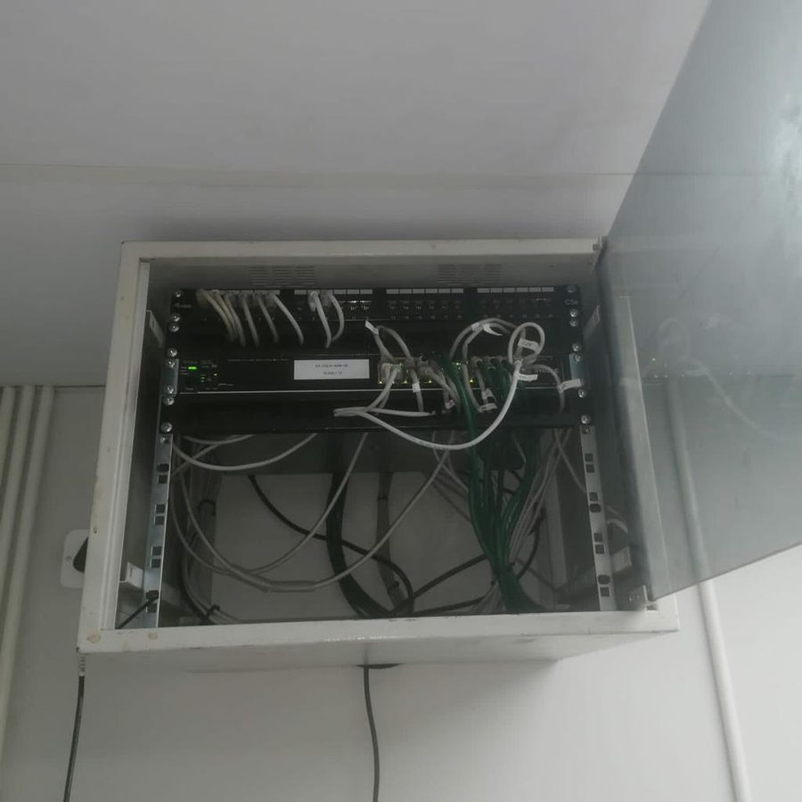 Network cabinet before tidy-up